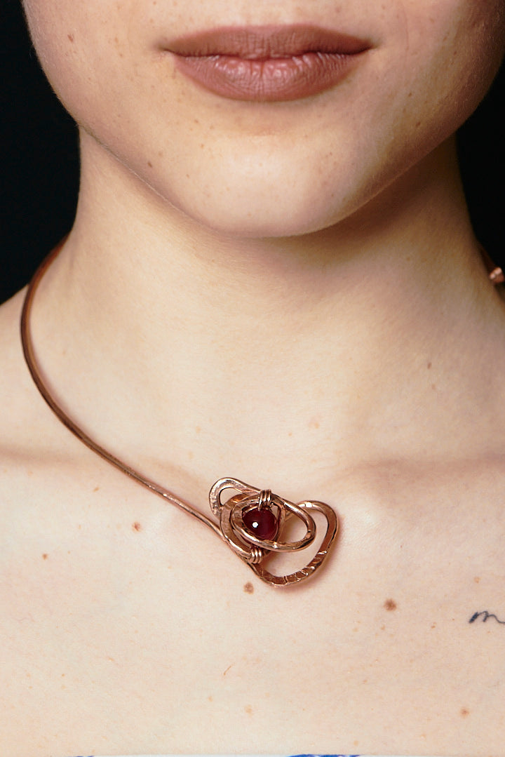 Nodo Solare – Sculpted Copper Pendant with Red Stone Bead