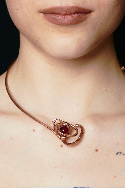 Nodo Solare – Sculpted Copper Pendant with Red Stone Bead